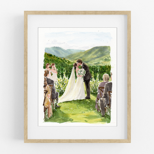 Framed watercolor portrait of a bride and groom at an outdoor wedding ceremony overlooking green hills.