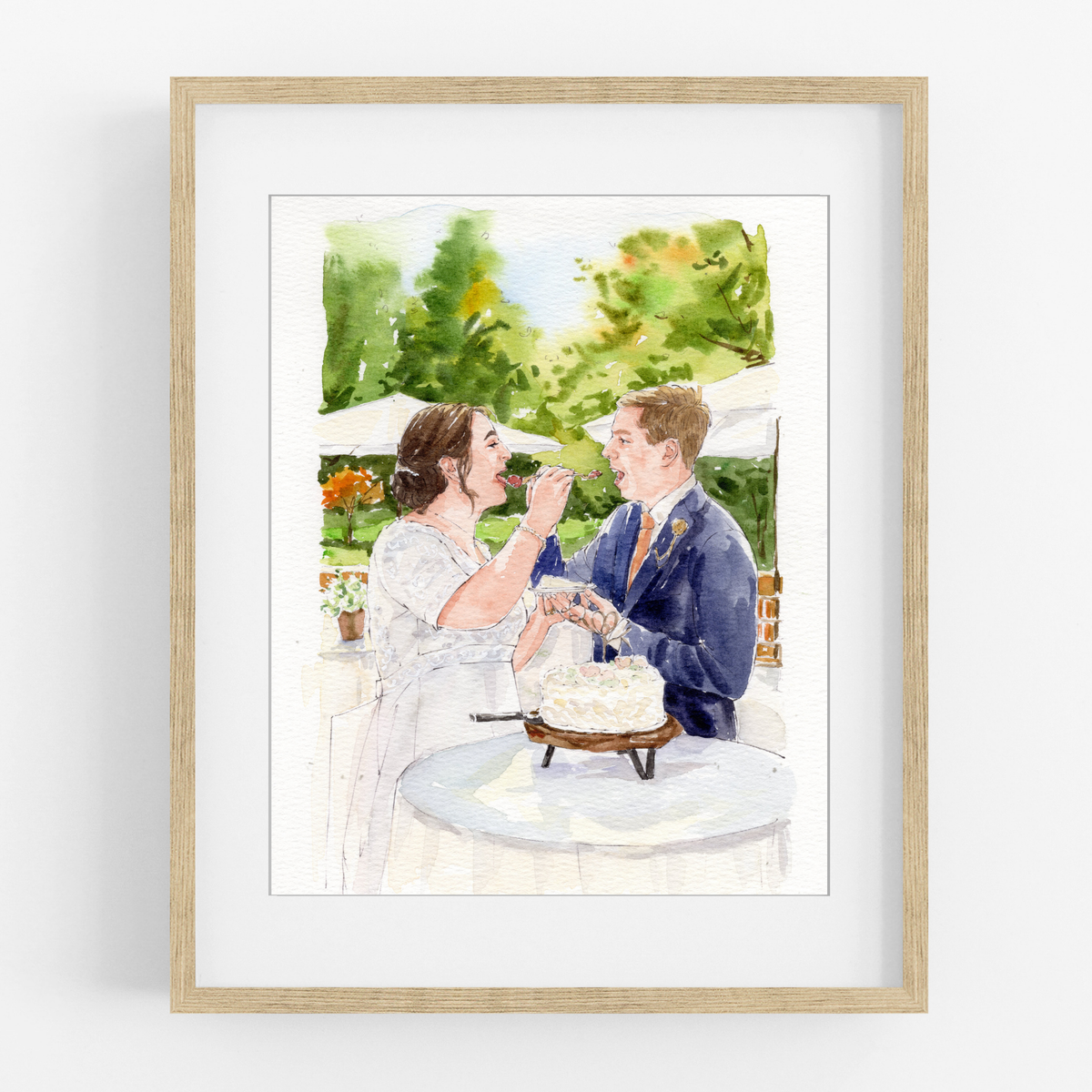 Framed watercolor portrait of a bride and groom smiling together beside their wedding cake outdoors.