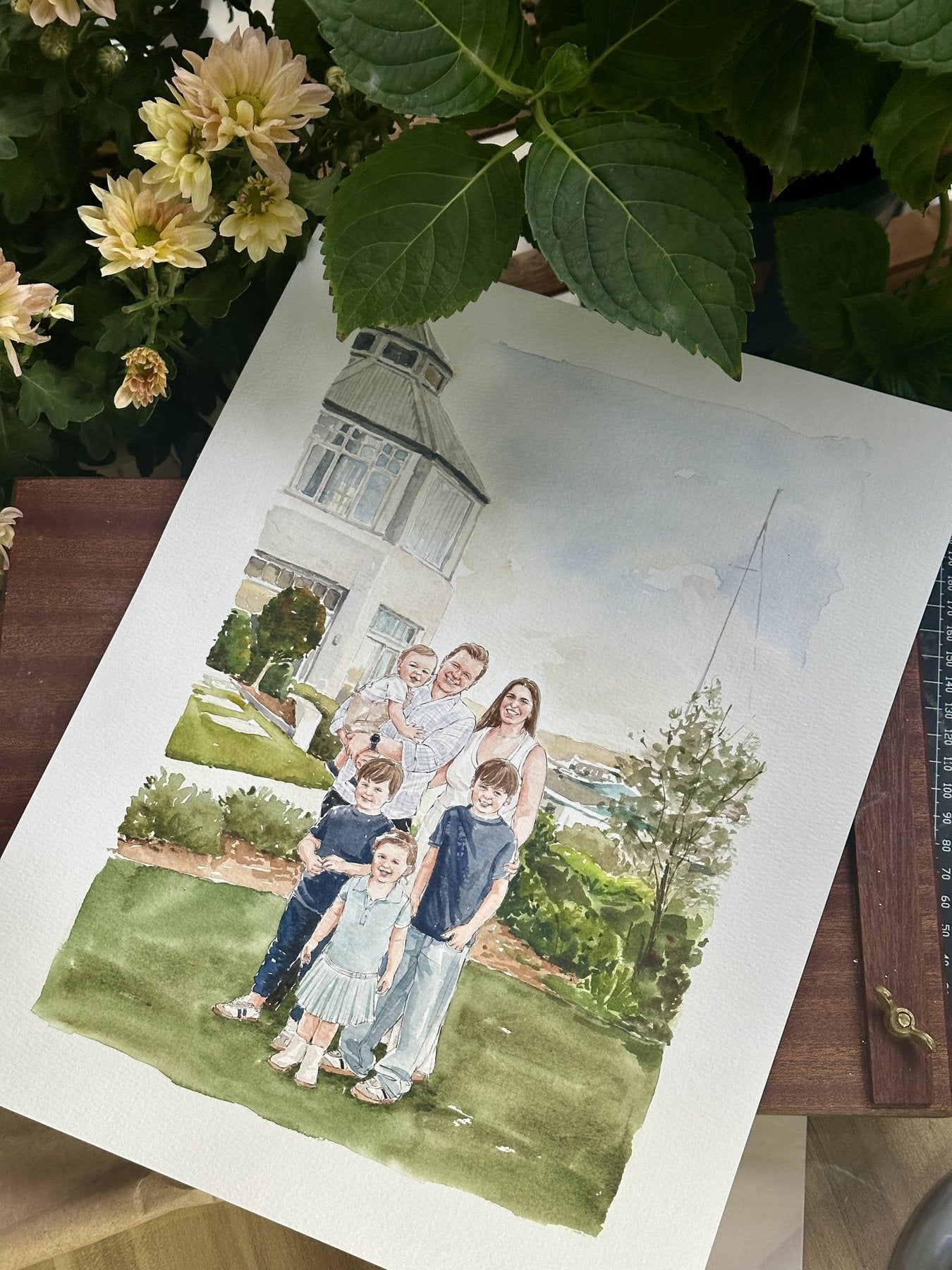 Finished watercolor portrait of a family together at home