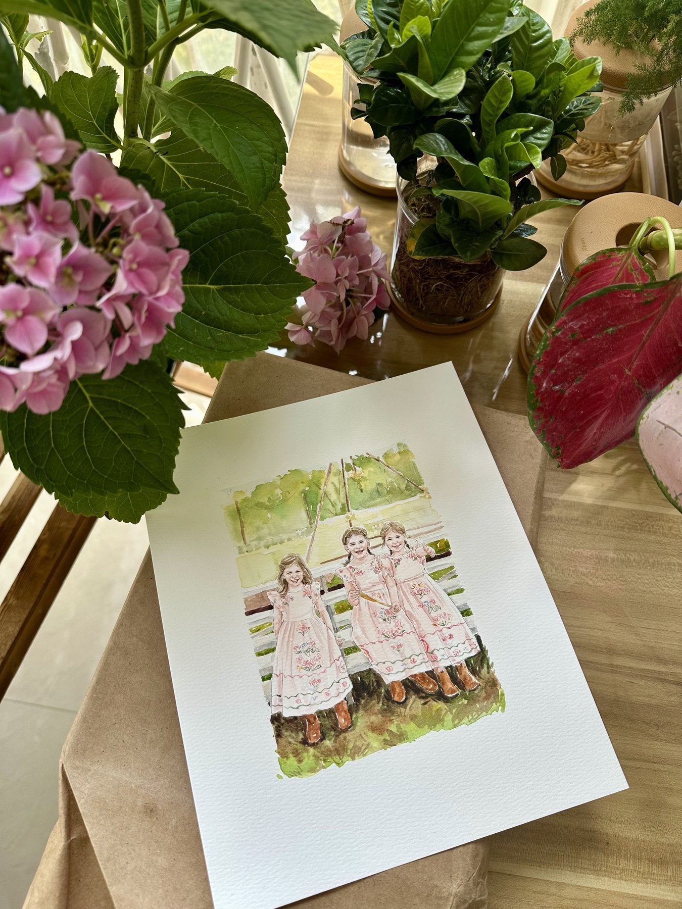 Finished hand-painted watercolor portrait of three sisters