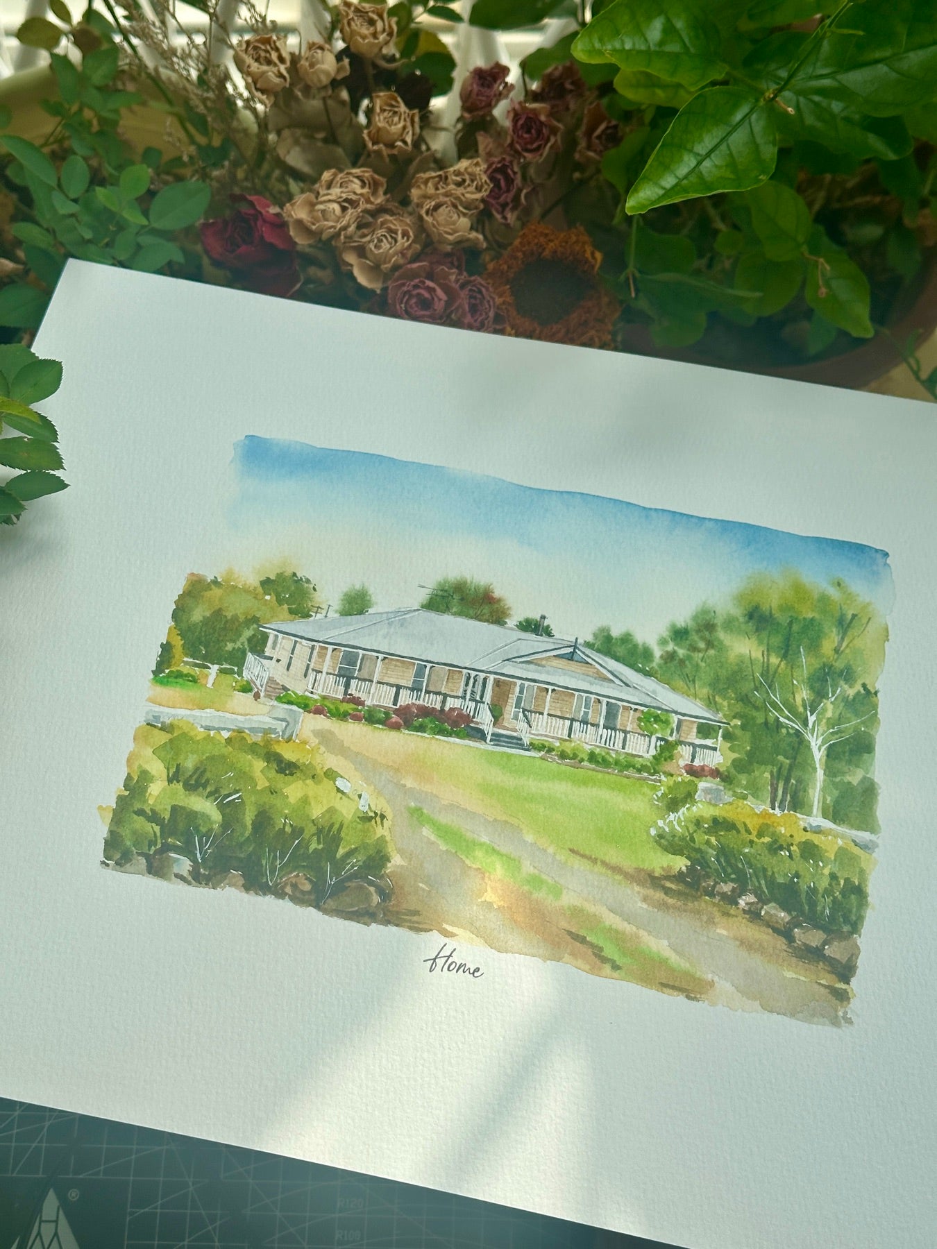 Finished hand-painted watercolor portrait of a country home with a long veranda