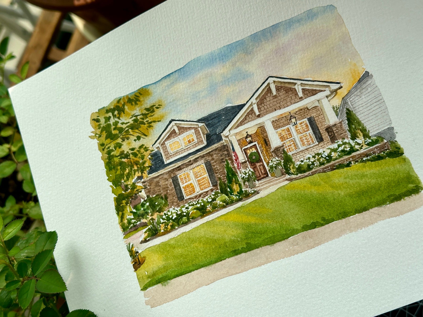 Finished hand-painted watercolor portrait of a warm-lit family home