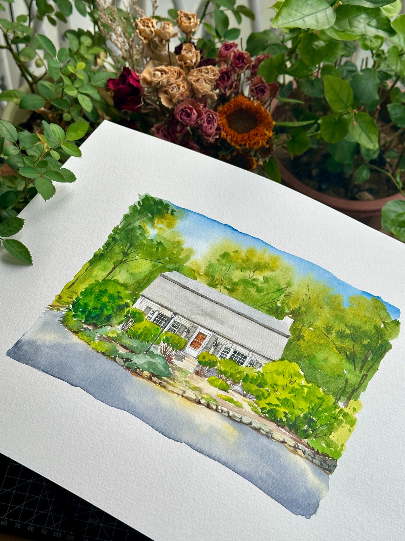 Finished hand-painted watercolor portrait of a woodland cottage