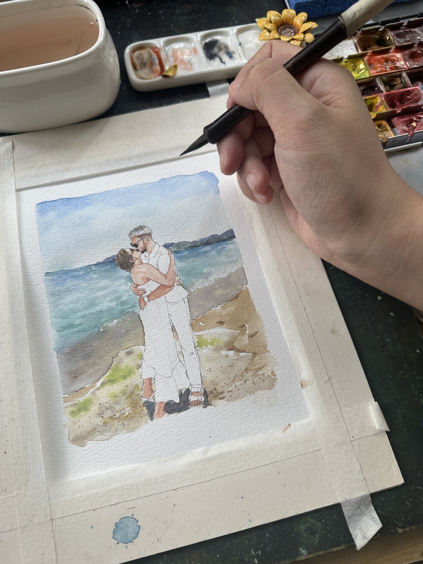 A beach embrace watercolor portrait in progress
