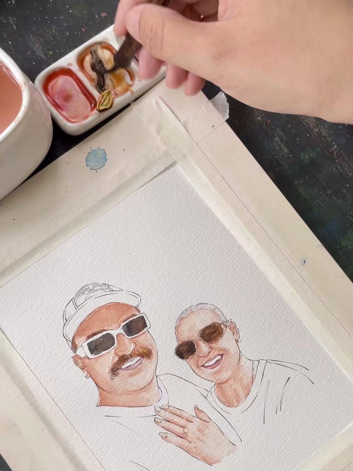 An engagement couple watercolor portrait in progress