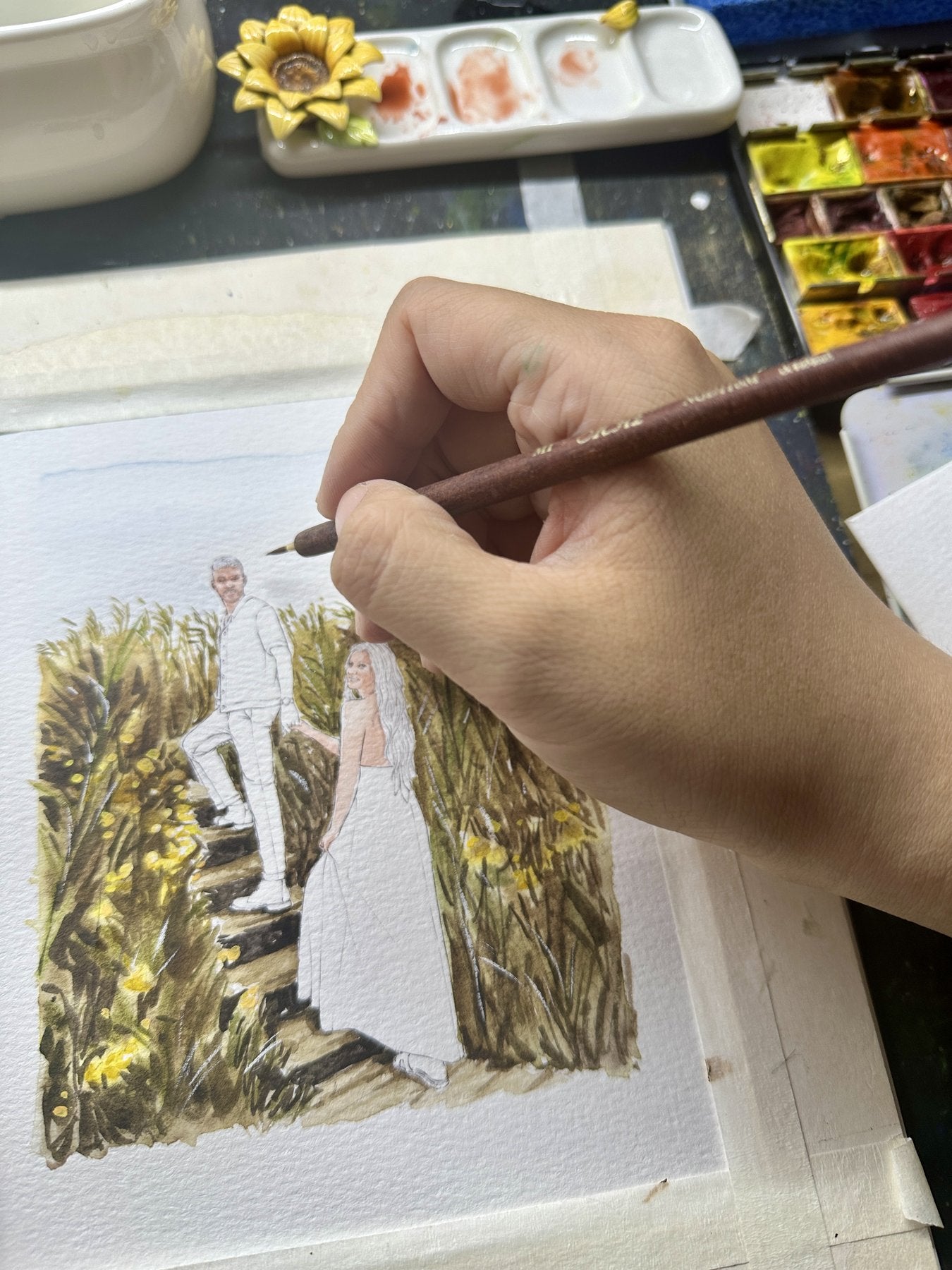 A couple in a meadow watercolor portrait in progress