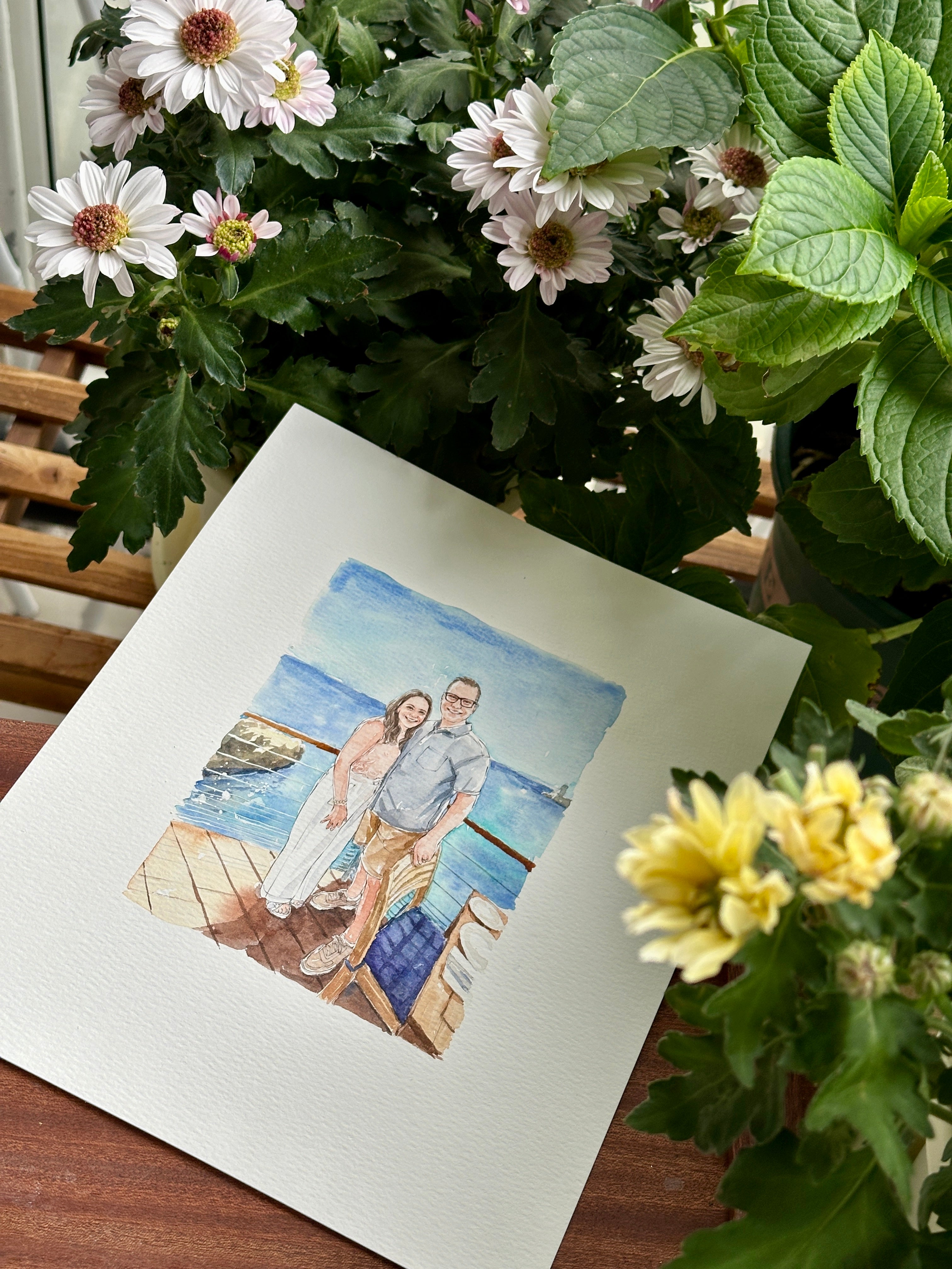 Longtime couple beside the ocean in a watercolor keepsake