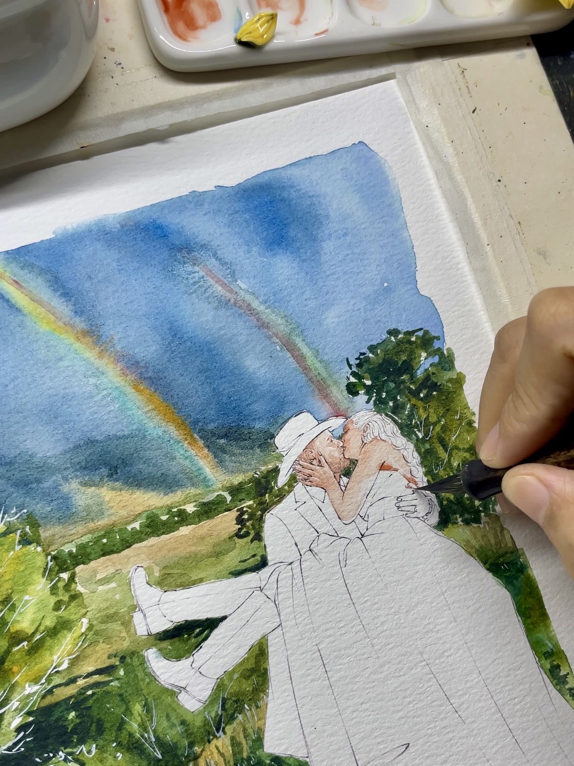 A rainbow wedding watercolor portrait in progress