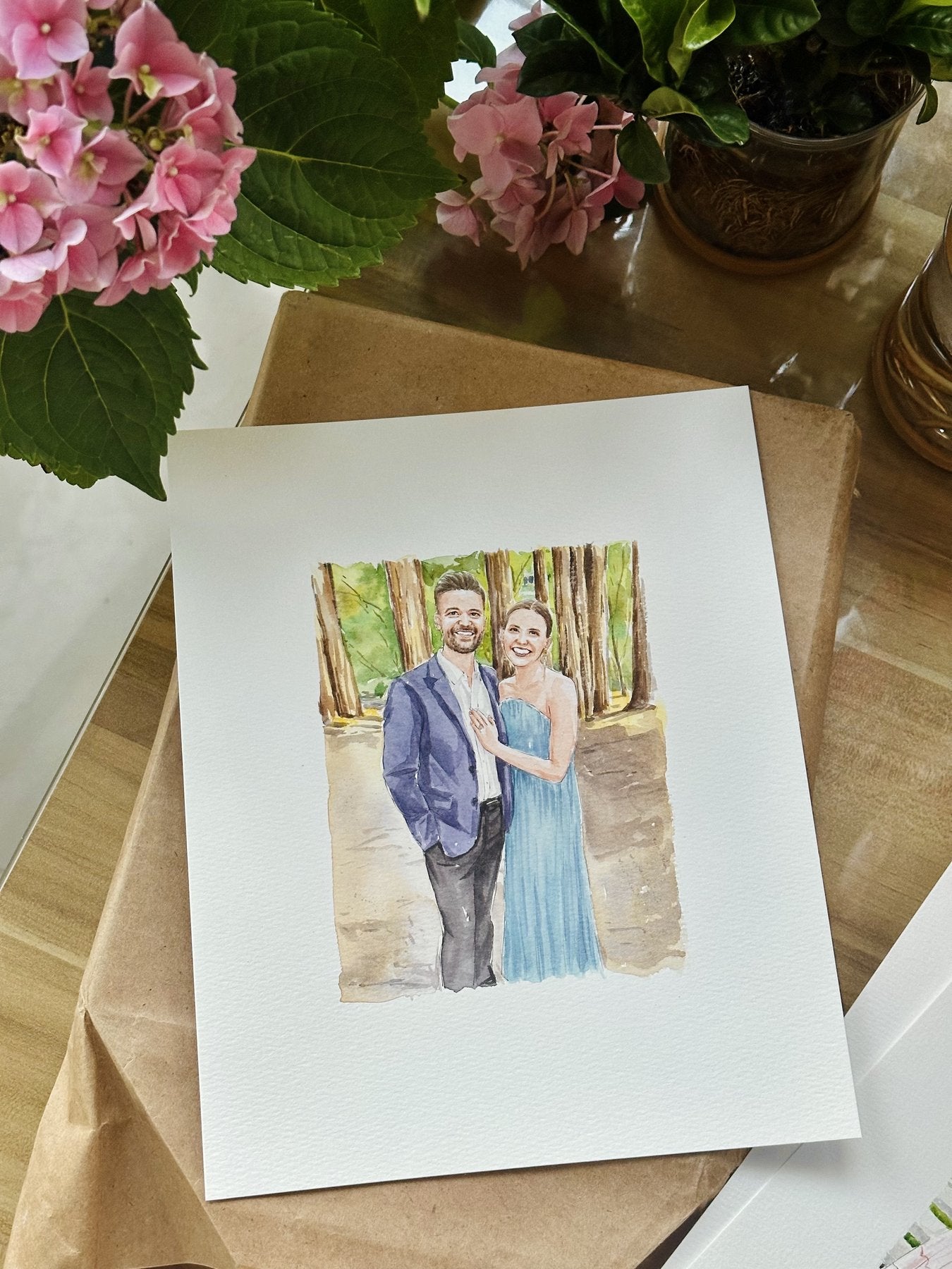 Finished hand-painted watercolor portrait of a couple among redwood trees