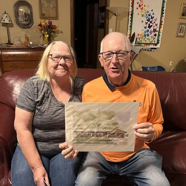 Customers holding a custom house watercolor portrait
