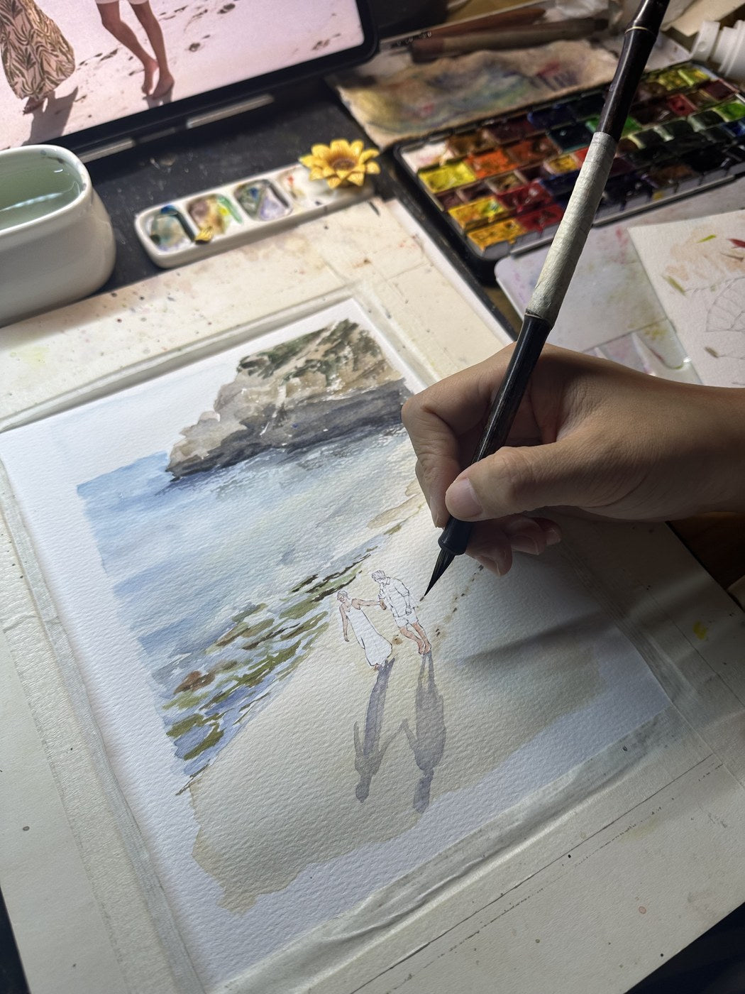 Hand-painting a custom wedding watercolor beach portrait in progress